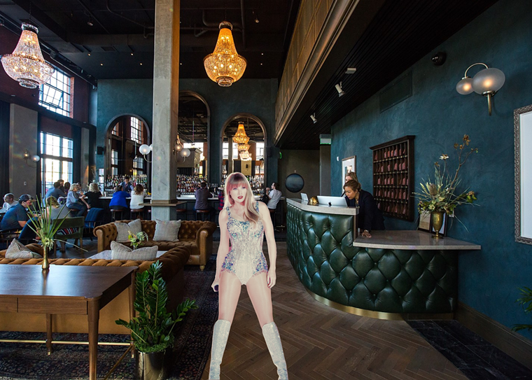 girl in a sparkly bodysuit in a hotel lobby with dark green walls and a bar in the background