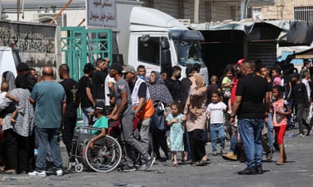 People flee the Jenin refugee camp in the occupied West Bank during an ongoing Israeli military operation.