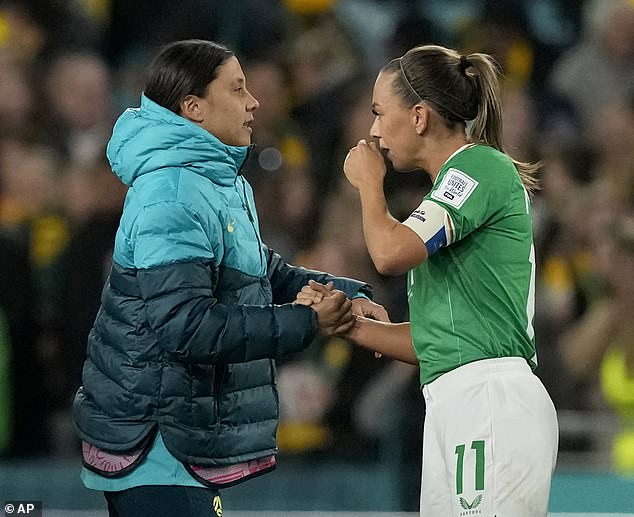 McCabe is seen shaking the hand of injured Aussie skipper Sam Kerr after the defeat