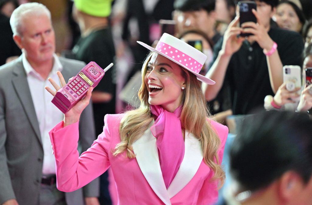 Australian actress Margot Robbie meets fans during a pink carpet event to promote her new film 