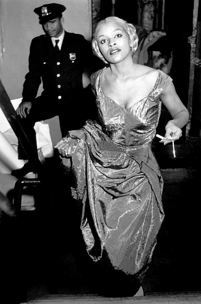 Model Charlotte Stribling aka ‘Fabulous’ waits backstage for the entrance cue to model clothes designed and made in the Harlem community. 1950