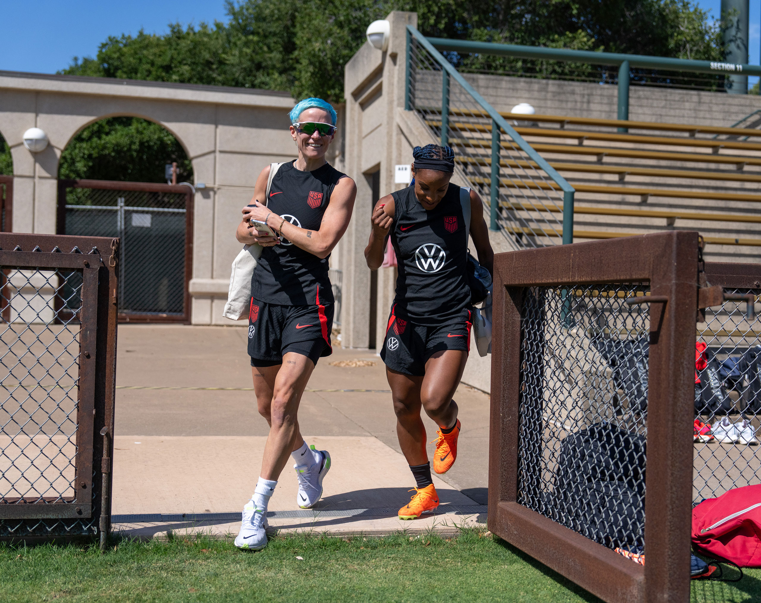 Megan Rapinoe and Crystal Dunn arrive at the field before USWNT training at Cagan Stadium in Stanford, Calif., on July 3, 2023. (Brad Smith—USSF/Getty Images)