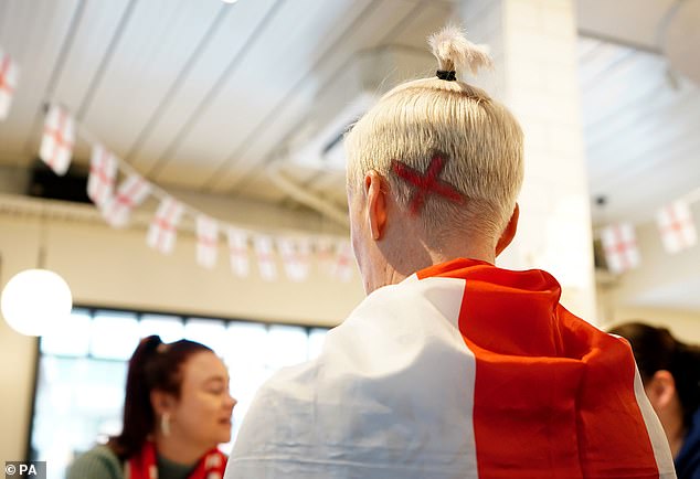 Some fans even sprayed England flags into their hair as well as being draped in flags