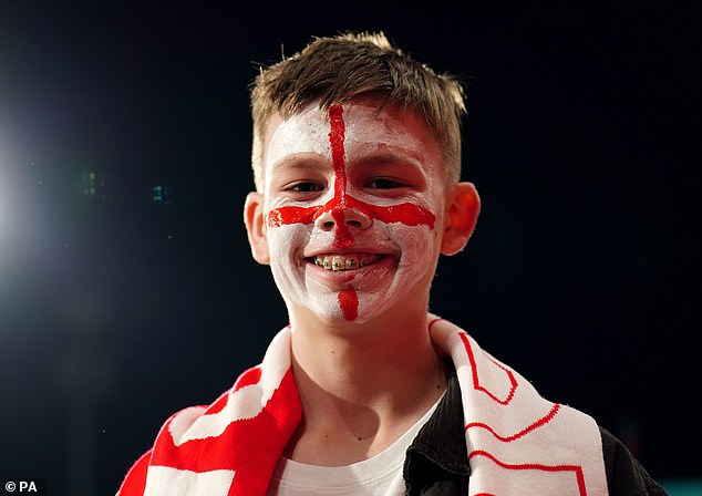 A young England fan smiles at the Hindmarsh Stadium ahead of England's final group game