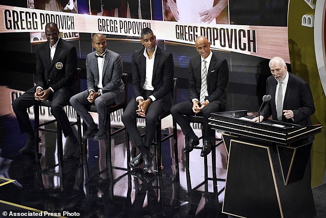 Gregg Popovich speaks during his enshrinement next to several fellow Spurs legends