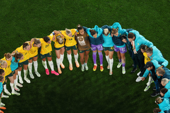 The Matildas huddle after victory over Denmark at Stadium Australia.