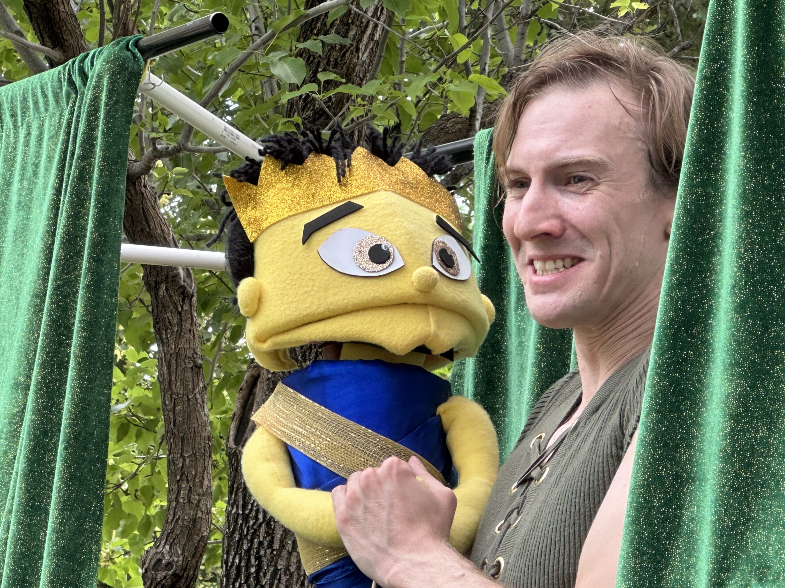 Actor Brett Crandall performs a part of his one-man puppet show at GC Pride Fest