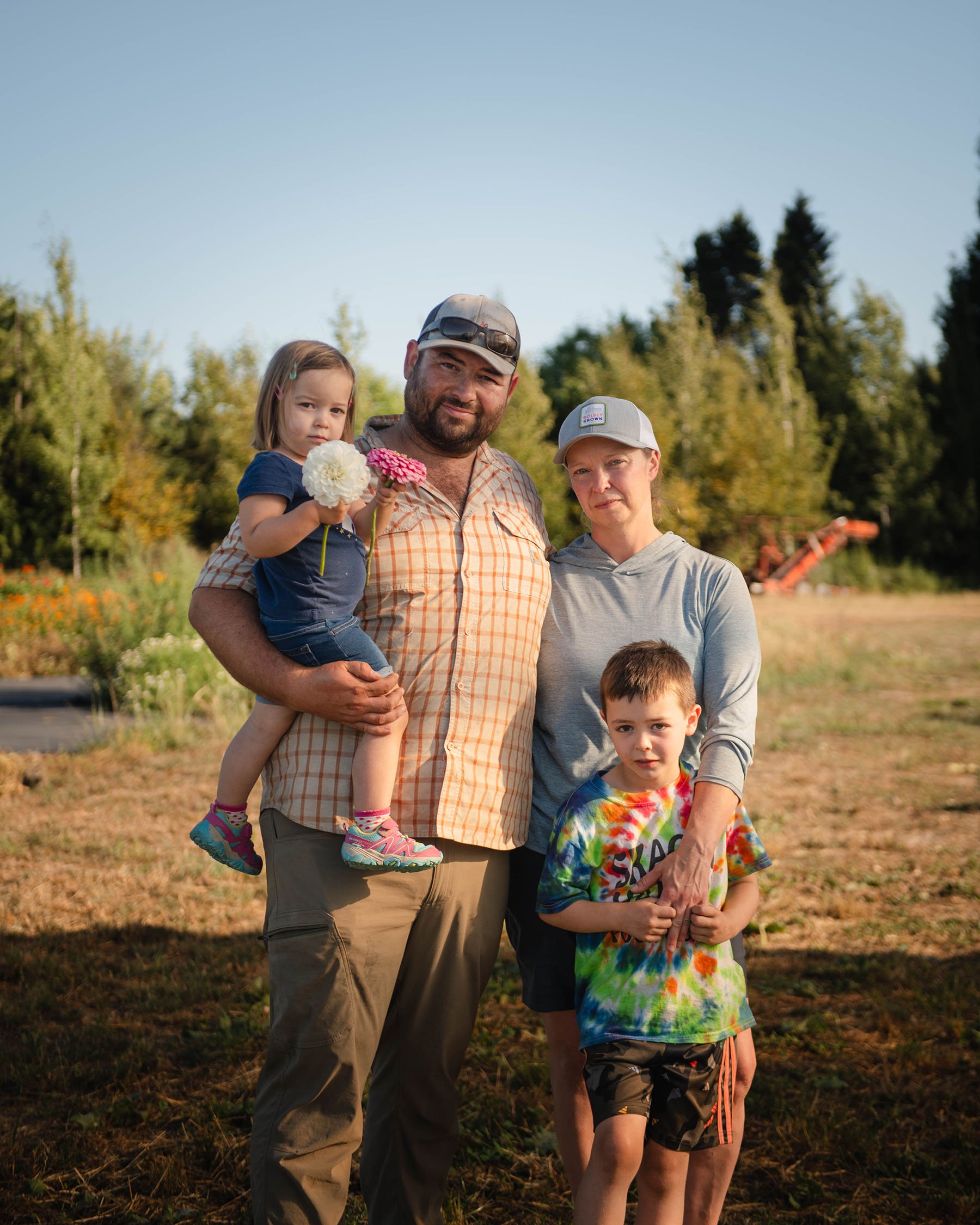 Amy Frye poses with her husband Jacob Slosberg and their children Leo and Ayla at their farm.