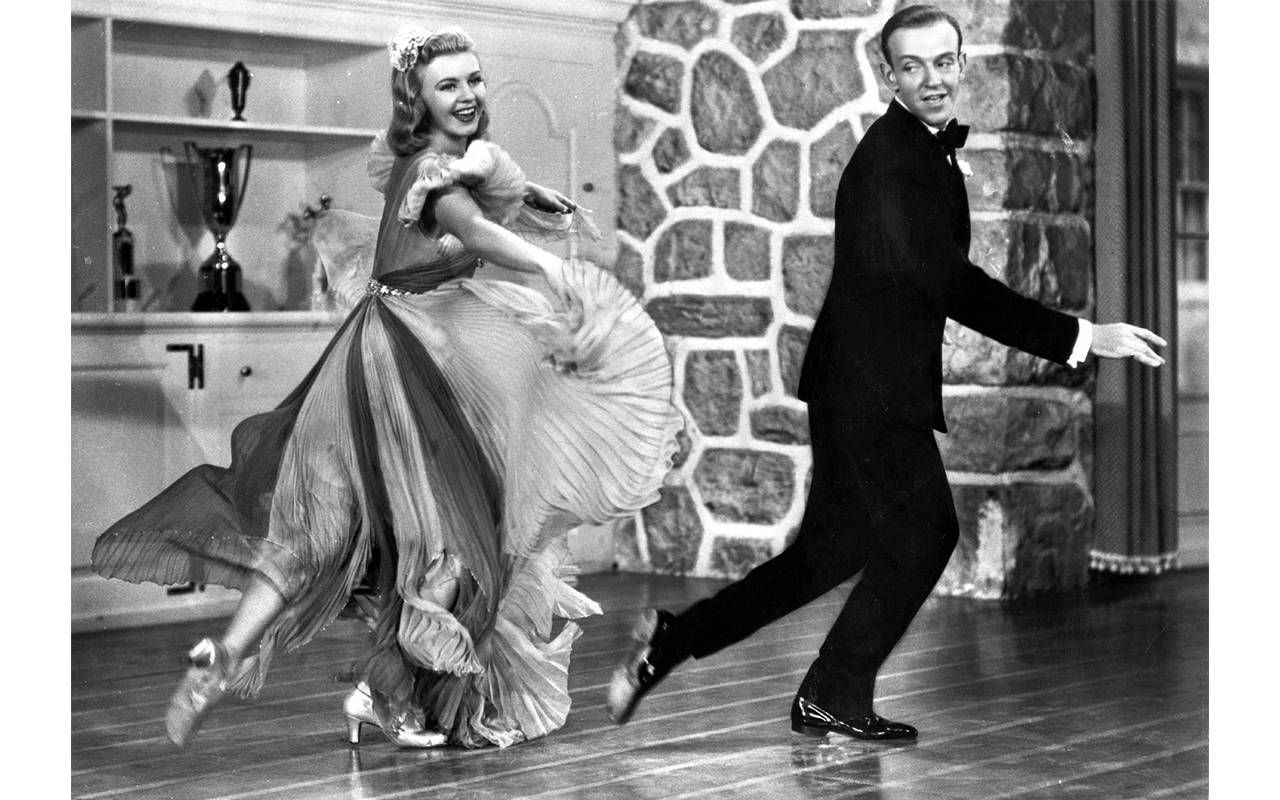 Ginger Rogers and Fred Astaire tap dancing together. Next Avenue