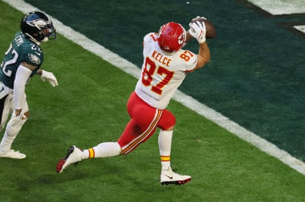 kelce runs while pursued by eagles player