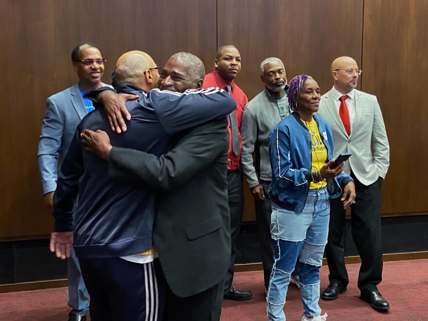  A group of people sentenced to life without parole as juveniles embrace during a legislative lobbying day at the State Capitol in Lansing in early October.
