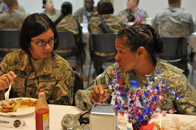 U.S Army Spc. Hannah McLauchlan, a San Antonio, Texas, native, with the 440th Medical Detachment (Blood Support), talks with U.S. Army Command Sgt. Maj. Donna Brock, the U.S. Army Medical Command senior enlisted adviser to the Army surgeon general, in 2012, at Bagram Airfield in Afghanistan. Photo by Capt. Abbie Leonhardt, courtesy of the U.S. Army.