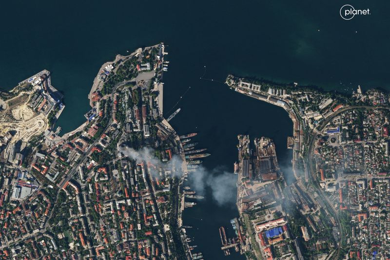 A satellite image shows smoke billowing from the headquarters of the Russian Black Sea Fleet after a Ukrainian missile strike in Sevastopol, Crimea.