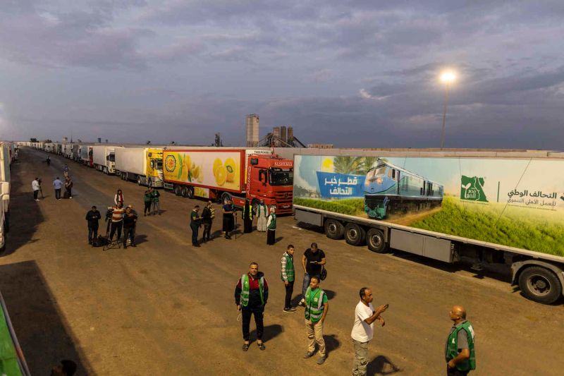 Aid convoy trucks are seen waiting to cross at Gaza's Rafah border on Oct. 17, 2023 in North Sinai, Egypt.