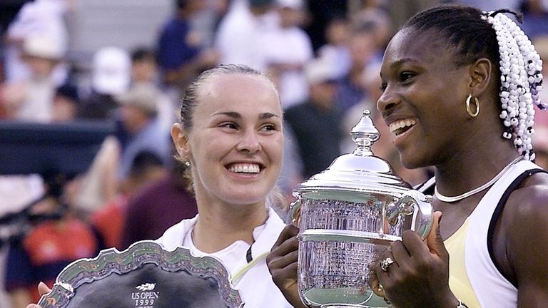 Serena Williams (R) of the US holds the US Open trophy after defeating number one seed Martina Hingis (L) of Switzerland 11 September, 1999, at the US Open Women's Final in Flushing Meadows, NY. Williams won the match 6-3, 7-6 (7/4). (ELECTRONIC IMAGE) AFP PHOTO/CAROL NEWSOM (Photo by CAROL NEWSOM / AFP) (Photo credit should read CAROL NEWSOM/AFP via Getty Images)