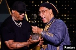 DJ Kool Herc receives the Musical Influence Award from LL Cool J during the 38th Annual Rock & Roll Hall of Fame Induction Ceremony in New York on Nov. 3, 2023.