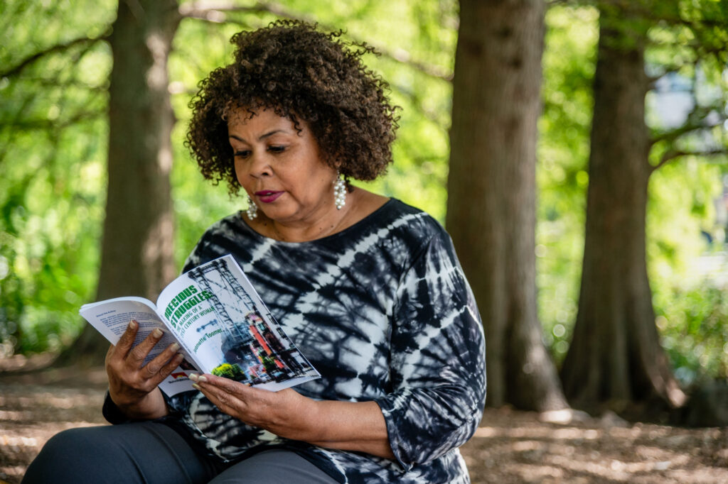 Jeanette Toomer reads aloud from her book, Precious Struggles: The Making of a 21st Century Woman, in New York's Central Park near her home. Credit: Michael Kodas