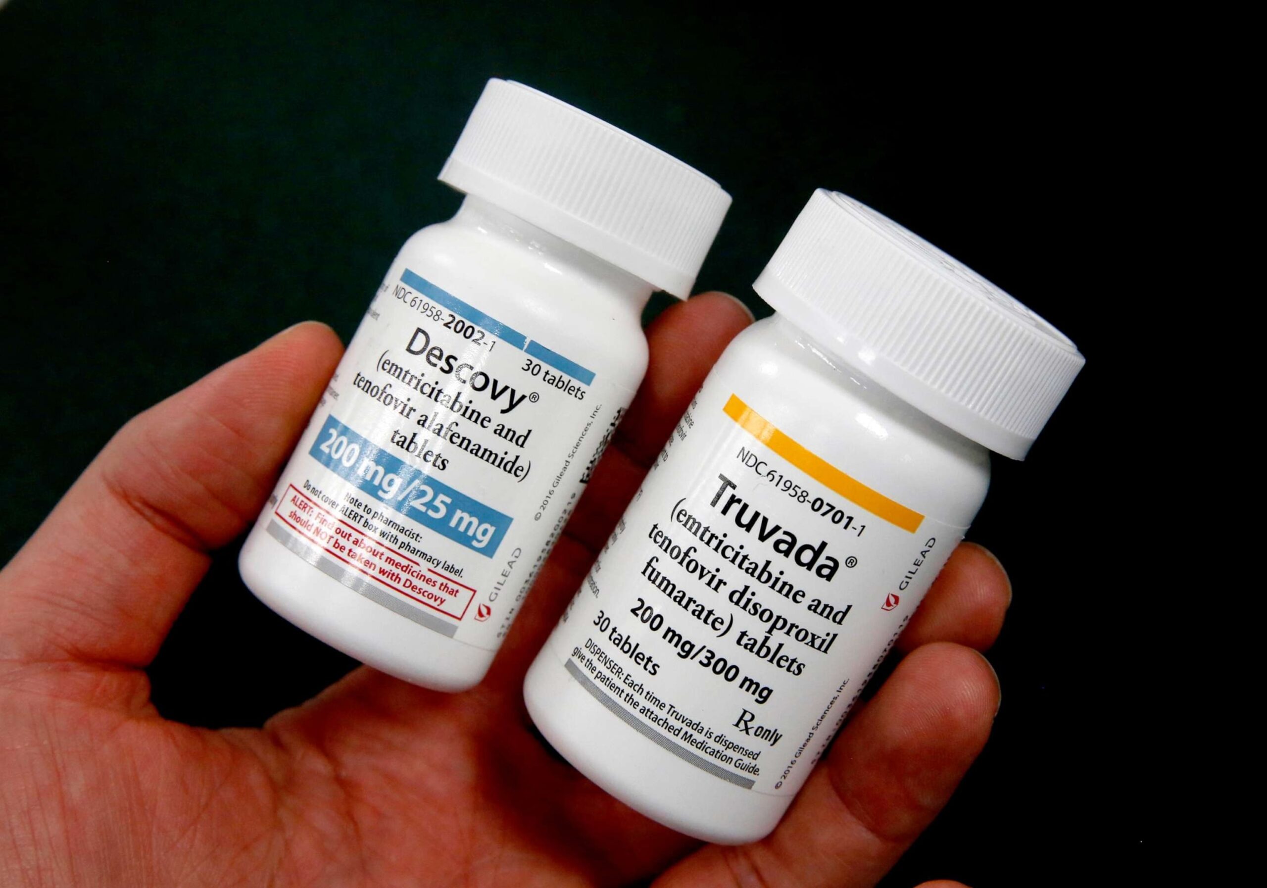 PHOTO: In this Oct. 7, 2019, file photo, a pharmacist displays the HIV prevention drugs Descovy, left and Truvada, right, at a pharmacy in Sacramento, Calif.