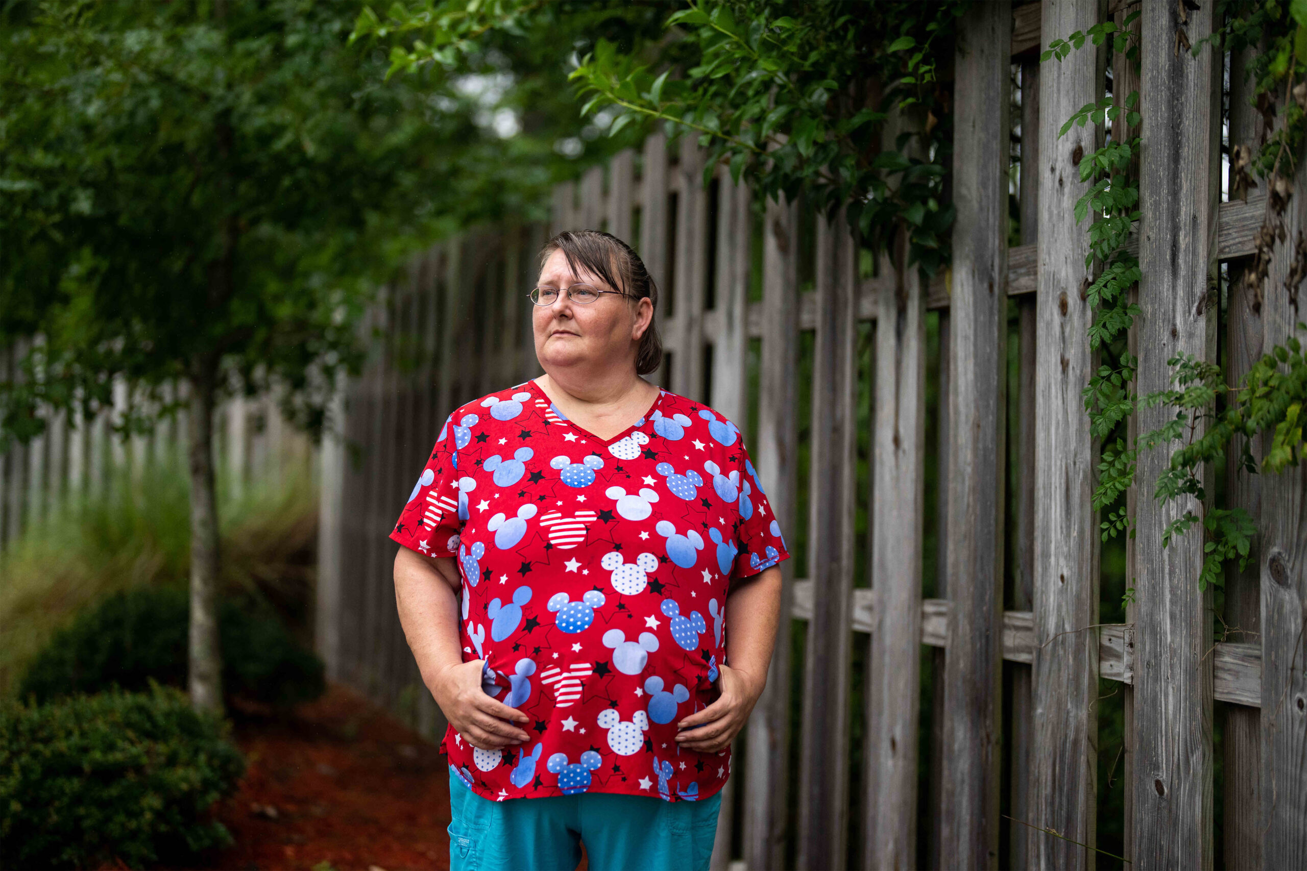A portrait of a home health aide standing outside.