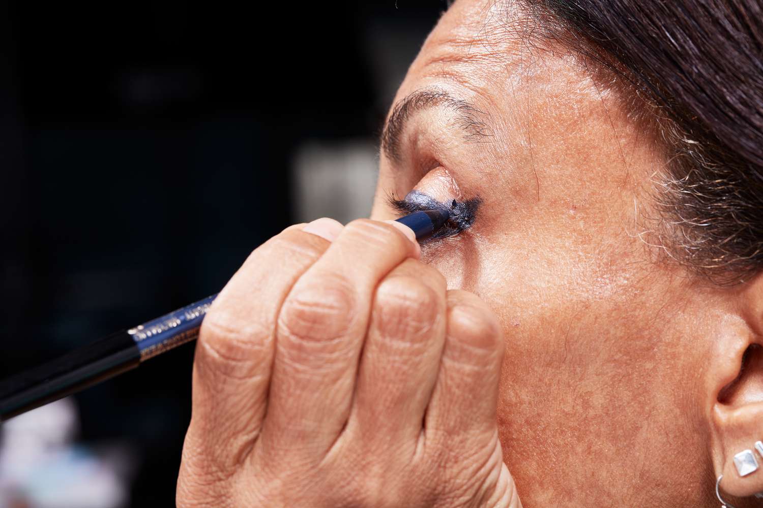 Person applying LancÃ´me Drama Liqui-Pencil Eyeliner