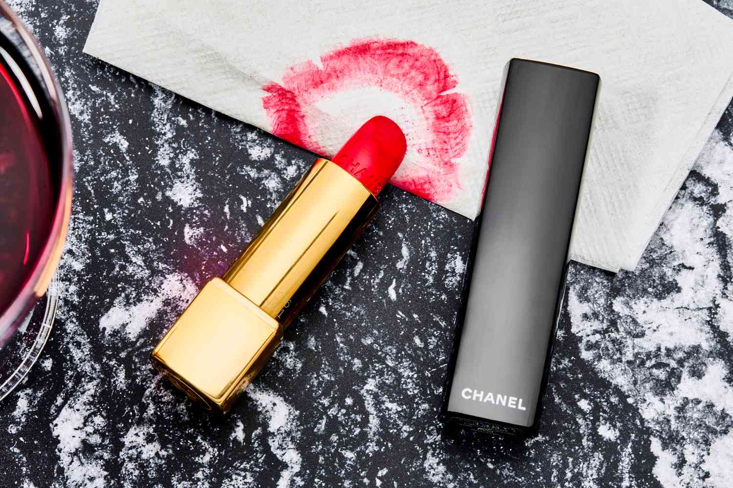 A close up of the Chanel lipstick and a smear on a napkin