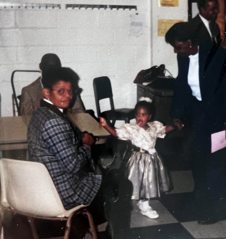 An old family photo shows an older woman and a young girl.