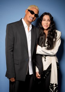 Alexander Edwards and Cher at Balmain Ready To Wear Spring 2024 held at Palais de Chaillot on September 27, 2023 in Paris, France. (Photo by Swan Gallet/WWD via Getty Images)